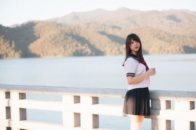 Woman in uniform standing outdoors