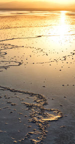 Scenic view of beach against sky during sunset