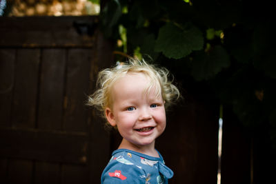 Portrait of cute girl smiling outdoors