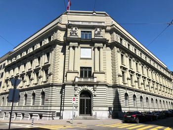 Low angle view of building against clear blue sky