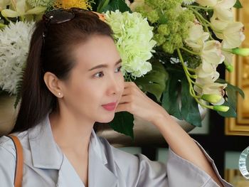 Portrait of beautiful young woman looking away