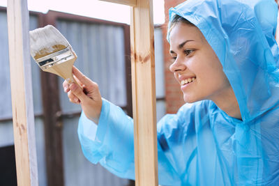 Portrait of young woman using mobile phone