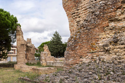 Old ruin building against cloudy sky