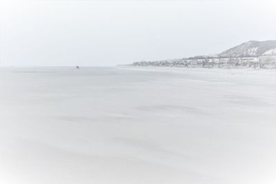 Scenic view of sea against clear sky during winter