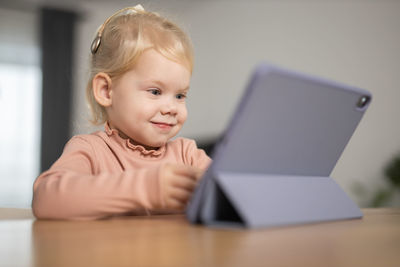 Boy using laptop at home