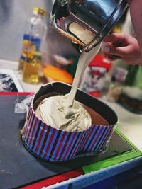 Close-up of person preparing food in kitchen