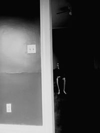 Man standing by door of building