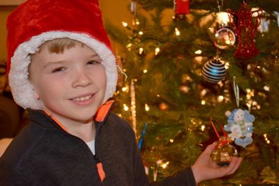 Happy boy with christmas tree