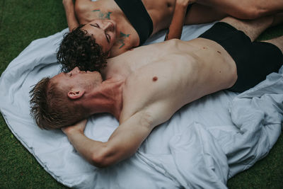 Young couple lying on bed