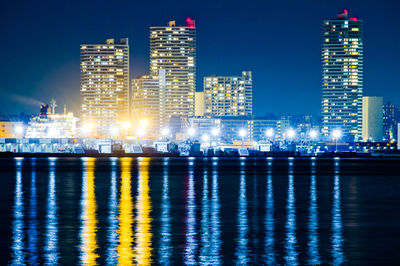 Illuminated buildings in city at night