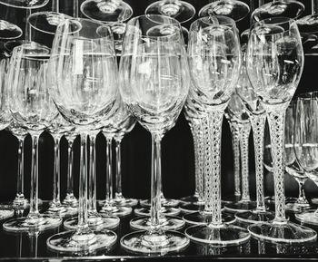 Close-up of wine glasses on table