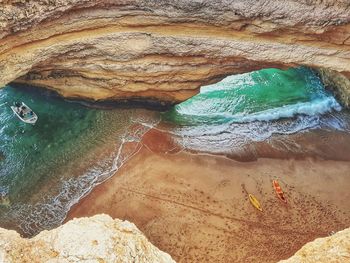 Aerial view of rock formation at beach 