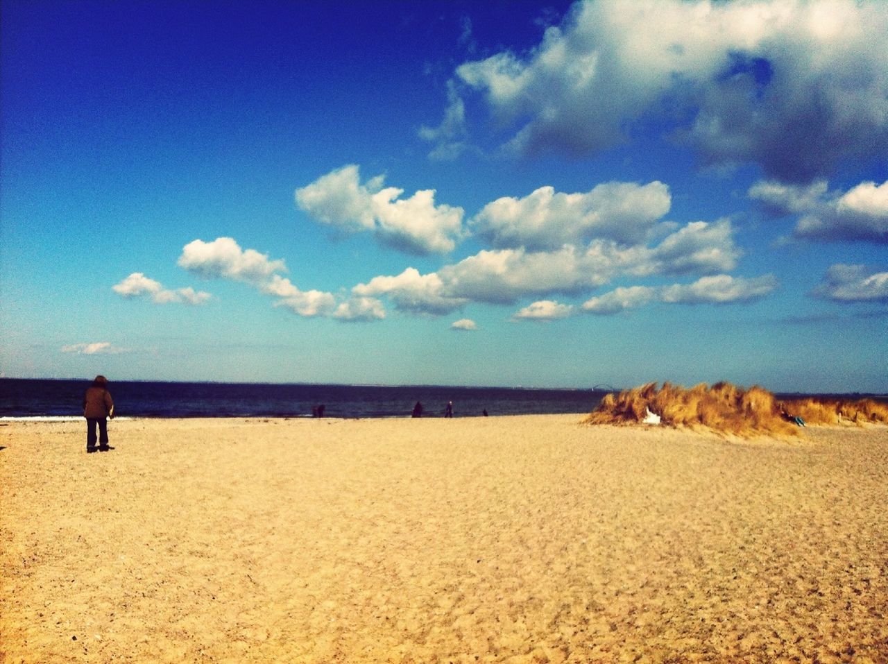 beach, sea, horizon over water, sky, tranquil scene, tranquility, sand, scenics, water, shore, beauty in nature, blue, nature, cloud, cloud - sky, idyllic, vacations, coastline, remote, incidental people