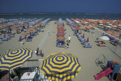 High angle view of people on beach against sky