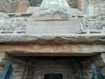 Low angle view of text on temple