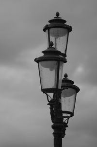 Low angle view of street light against sky