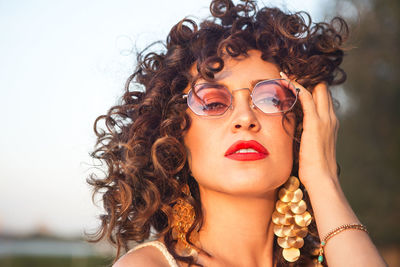 Close-up portrait of beautiful woman wearing eyeglasses