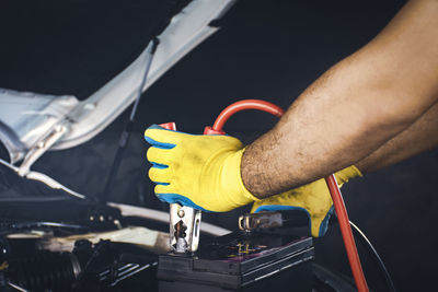 Close-up of man working on bus