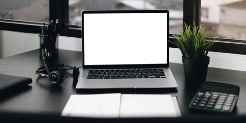 Close-up of laptop on table