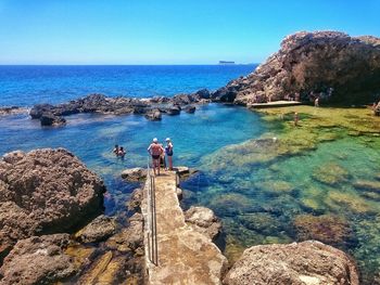 Scenic view of sea against blue sky