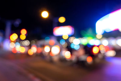 Defocused image of illuminated city at night