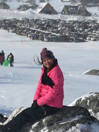 Woman with umbrella in snow during winter