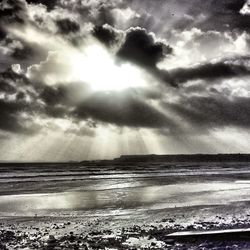 Scenic view of sea against cloudy sky