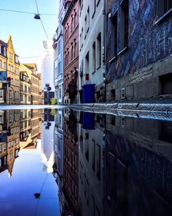 Reflection of buildings in puddle