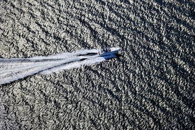 Aerial view of motorboat sailing in sea