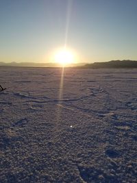 Scenic view of sea against clear sky during sunset