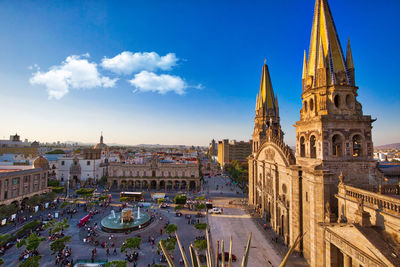 High angle view of cathedral against blue sky in city