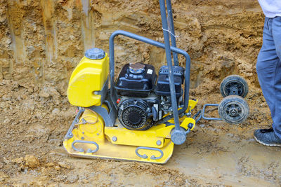 Low section of man working on field