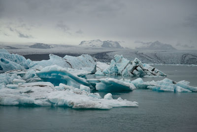Scenic view of frozen lake against sky