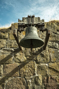 Bell against wall in historical fortress