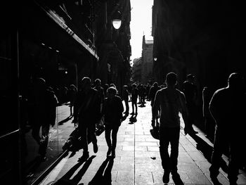 People walking on street in city