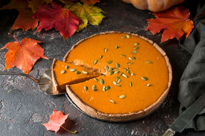 High angle view of orange leaves on table