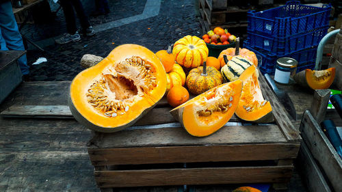 High angle view of pumpkins in crate