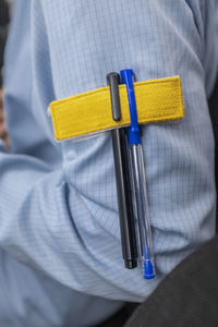 Close-up of human hand holding cross