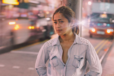 Woman standing at night