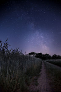 Scenic view of field against sky at night