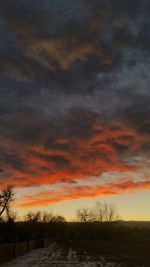 Scenic view of landscape against cloudy sky