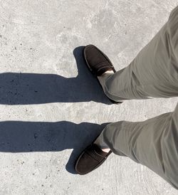 Low section of man standing on floor