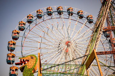 Closeup of multi-coloured giant wheel during dussehra mela in delhi, india. bottom view giant wheel