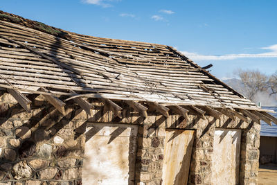 Low angle view of old stone bathhouse building against sky