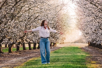 Full length of woman standing on field