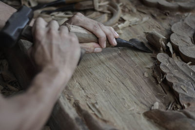 Cropped image of carpenter working in carpentry workshop