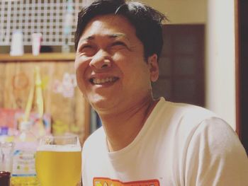 Portrait of young man looking at restaurant