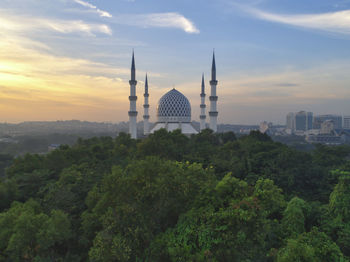 High angle view of trees and buildings against sky