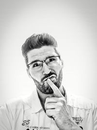 Portrait of young man against white background