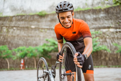 Portrait of man riding bicycle